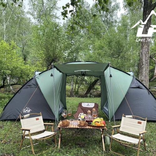 a two-bedroom tent is pced on the road with two bedrooms and one living room. uv protection can be customized，