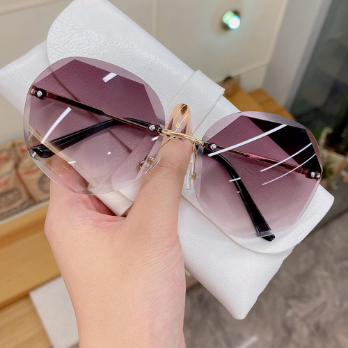 2022 new irregular rimless sunglasses women‘s fashionable metal round frame sunglasses ins marine sunglasses