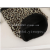 Male and female leopard print patterns winter scarf and hat to protect the cold.