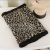 Male and female leopard print patterns winter scarf and hat to protect the cold.