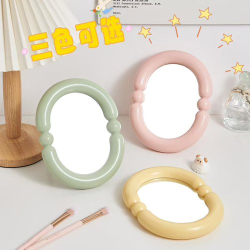 Creative candy colored oval multifunctional makeup mirror foldable upright and portable makeup mirror