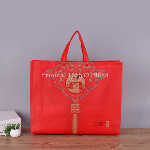 in sto wholesale non-woven textile bag four-piece handbag red printed gift paaging bag coated logo