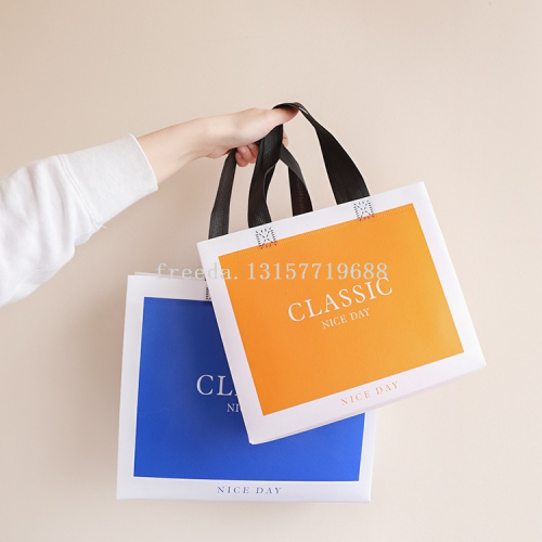 in sto non-woven handbag wholesale fashion clothing store promotional handbag film tote bag can be printed logo