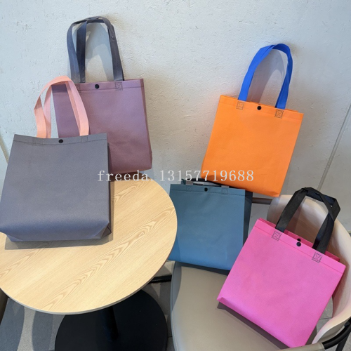 批发高级加暗扣服装店手提袋子无纺布袋批发可印刷logo童装购物袋