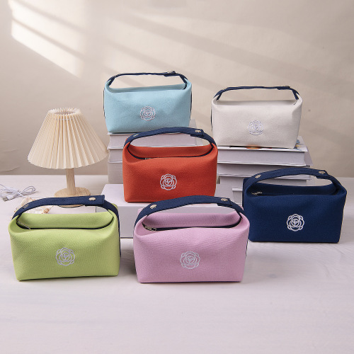 旅行便携25年包山茶花手提化妆包新款高级感化妆品口红钥匙收纳袋