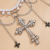 Cross tassel waist chain for women, adorned with body chain, featuring faux pearls and vintage beaded design