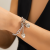 Versatile Rhinestone Bracelet Necklace: A sweet and cool metal necklace for women featuring a heart-shaped tassel orname