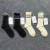 Socks Tide style men's and women's uniform solid color striped mid-tube socks jacquard thin cotton embroidery alphabet stockings
