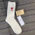 Socks female ami wool mid-tube socks solid color embroidery peach heart casual socks fashion tide cashmere stockings