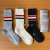 Socks men and women with four bars in the tube socks solid color cloth label large line striped jacquard leisure socks s