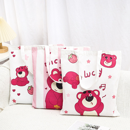 大容量草莓熊帆布袋装书上课通勤手提帆布包包女新款单肩包