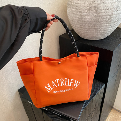 新款时尚字母手提包外出上班通勤便当包大容量轻便休闲收纳包