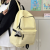 new school bag female junior high school student large capacity solid color travel backpack men high school and college student campus lightweight backpack